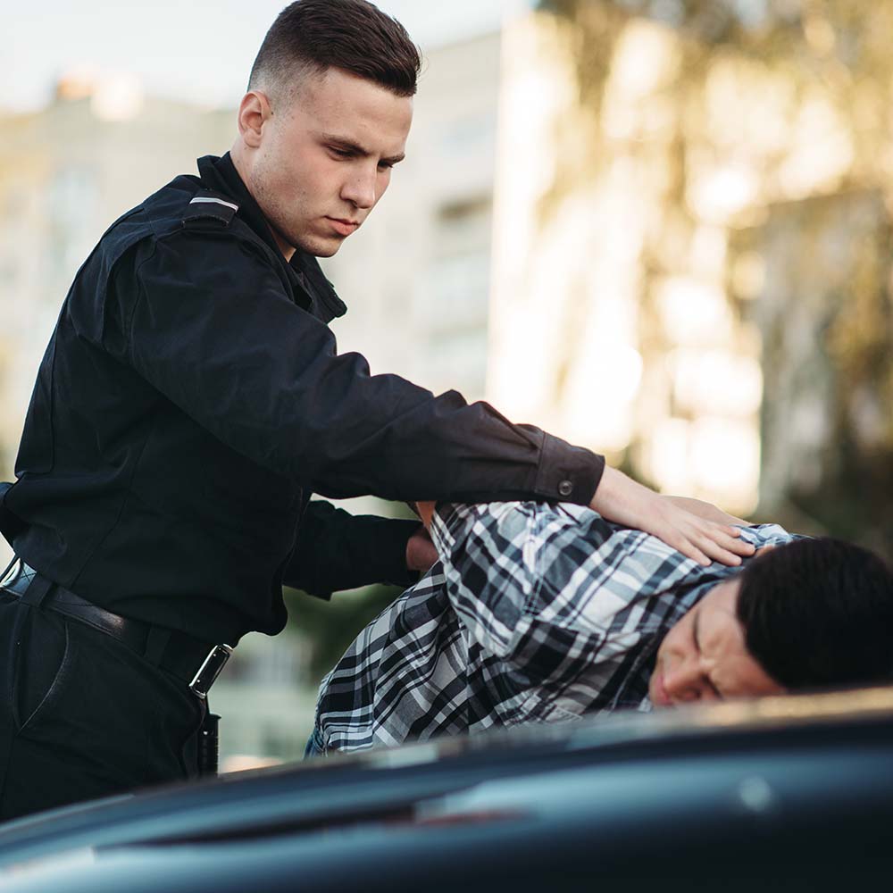 police-officer-arrests-the-driver-violator-on-road-PFGYNAU.jpg